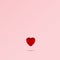 Red heart levitating against pink background. Minimal love concept, love background with copy space