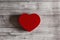 Red heart over grey wood background, isolated. Valentines day concept
