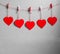 Red heart paper cut with natural cord and red clips hanging on the wall, copy space,valentines day - Image