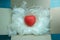 Red heart in parcel box with shredded paper  packing and sending Love on Valentine\\\'s day concept