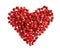 Red heart shape made of pomegranate seeds