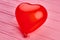 Red heart shaped balloon.