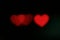 Red heart-shaped on black background Colorful lighting bokeh for decoration at night backdrop wallpaper blurred valentine, Love Pi