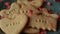 Red heart shaped confetti fall on love cookie