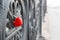 Red heart shaped lock on grey bridge. Love concept