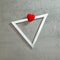 Red heart on a silver triangular frame on a gray concrete background. Text space. Top view. Minimal style
