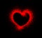 Red heart with splatter glow on black background. Passionate heart symbol. Love heart for sex shop, condoms logo