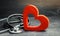 Red heart and stethoscope. The concept of medicine and health insurance, family, life. Ambulance. Cardiology Healthcare.