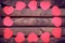 Red heart stickers on a wooden background