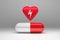 Red heart with stroke lightning sign and large pill capsule