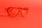 Red heart sunglasses on red background