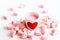 Red heart symbol on strawberry milk cup and pink candy heart on