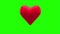 Red heart thumping on green background