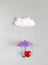 Red heart under purple umbrella