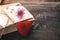 Red heart and vintage novel book -