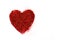 Red heart on a white background. Heart of glitter grains. glitter makeup