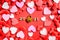 Red hearts background and a love padlock committed to Valentine`s Day in 2021