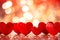 Red hearts on a blurred background with romantic bokeh. Valentine's Day concept.