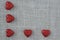 Red Hearts on Burlap Background