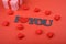 Red hearts with gift box on red background and inscription I love you. top view. Valentines day, mothers day, holiday