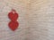 Red hearts hang on brick wall near corner of room. Symbol of love. Lovers symbol