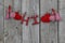 Red hearts and Hi hanging on clothesline