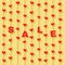 Red hearts and letters Â«SALEÂ» hanging on strings on yellow background.