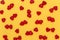 Red hearts lie on a yellow background. Concept for valentine`s day.