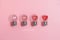 Red hearts in light bulbs. Loading progress bar on pink background