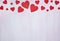 Red hearts on a lilac wooden background