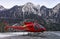 Red helicopter in heliport at swiss alps