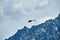 Red helicopter in the sky over the Caucasus Mountains, a beautiful mountain landscape
