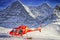 Red helicopter at swiss ski resort near Jungfrau mountain