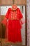 The red henna dress was hanging . Azerbaijan traditional dress, whith gold Henna