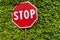 Red hexagonal stop sign on metal pole