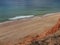 Red high cliffs at Praia da Falesia, a paradise beach in Albufeira in Portugal