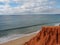 Red high cliffs at Praia da Falesia, a paradise beach in Albufeira in Portugal