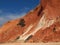 Red high cliffs at Praia da Falesia, a paradise beach in Albufeira in Portugal