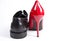 Red high heel and a black mans shoe