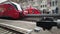 Red high-speed trains on the platform of the train station