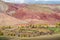 Red hillsides in the valley of the Kyzylshin river