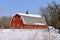 Red hip=roofed barn with melting snow on the roof