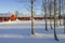 Red holiday cottages in a winter landscape