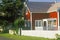 Red home with white picket fence