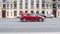 Red Honda Civic eighth generation in motion on the urban road with blurred background
