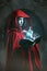 Red hooded woman casting powerful magic