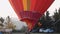 Red hot air balloon ready for takeoff at Fragneto Monforte