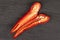 Red hot cayenne chili on grey stone