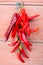 Red hot chilly peppers hanging on a wire