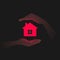 Red house icon and hands carefully protecting it in darkness